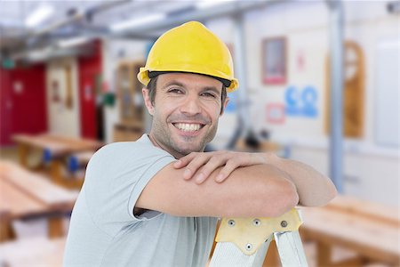 simsearch:400-08077010,k - Happy technician leaning on step ladder against workshop Foto de stock - Super Valor sin royalties y Suscripción, Código: 400-08077091