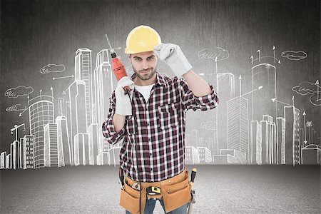 Confident handyman holding drill machine against hand drawn city plan Stock Photo - Budget Royalty-Free & Subscription, Code: 400-08077317