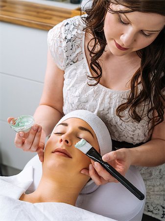 facial mask brush - Photo of a young beautiful girl receiving a green facial mask in spa beauty salon. Stock Photo - Budget Royalty-Free & Subscription, Code: 400-08077718