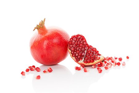 simsearch:640-02656973,k - Fresh ripe pomegranate isolated on white background. Healthy fruit eating. Fotografie stock - Microstock e Abbonamento, Codice: 400-08077730