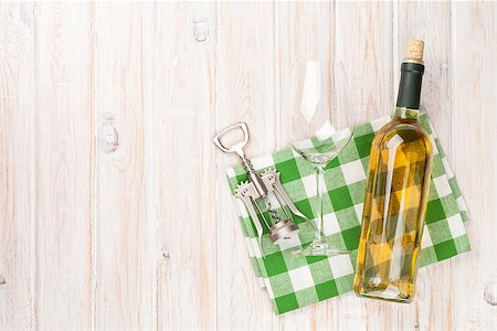 simsearch:400-07937813,k - White wine bottle, glass and corkscrew on white wooden table background. Top view with copy space Photographie de stock - Aubaine LD & Abonnement, Code: 400-08078049