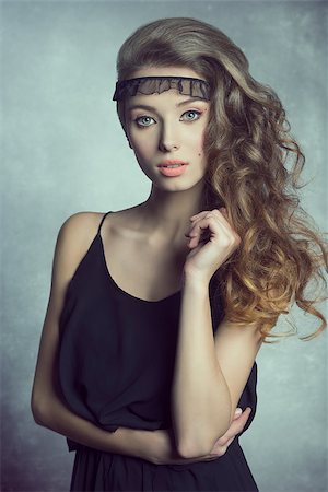 simsearch:400-06790945,k - cute brunette woman posing with summer black dress, nice make-up and long wavy healthy hair. Photographie de stock - Aubaine LD & Abonnement, Code: 400-08078176