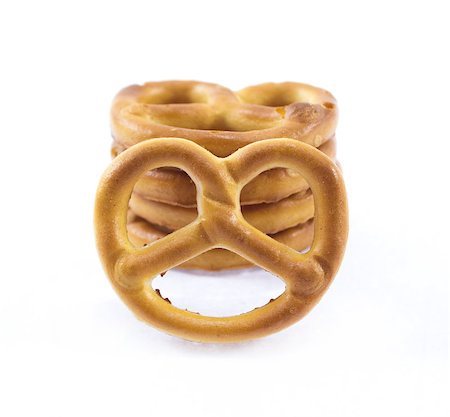 pretzel stick - salted cookies stack on white background. Foto de stock - Super Valor sin royalties y Suscripción, Código: 400-08070315