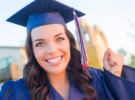 Happy Graduating Mixed Race Woman In Cap and Gown Celebrating on Campus. Stock Photo - Budget Royalty-Free & Subscription, Code: 400-08070490
