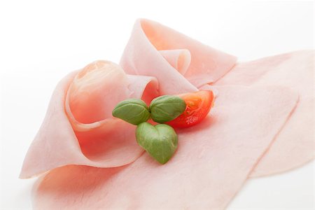 simsearch:400-08071181,k - Ham slices with fresh tomato and basil leaves isolated on white background. Culinary meat gastronomy background. Foto de stock - Super Valor sin royalties y Suscripción, Código: 400-08070589