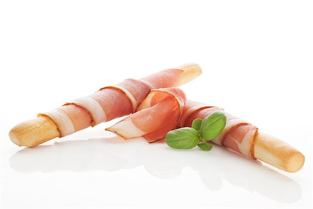 simsearch:400-08070576,k - Culinary gourmet starter. Grissini bread wrapped in prosciutto ham. Eating. Foto de stock - Super Valor sin royalties y Suscripción, Código: 400-08070580