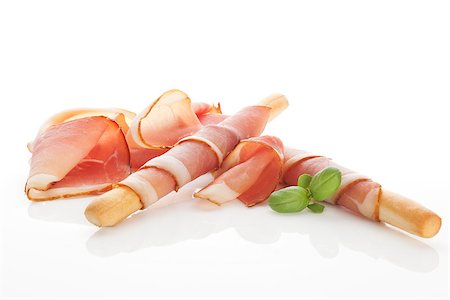 simsearch:400-08070576,k - Culinary food. Parma ham prosciutto with grissini bread sticks isolated on white background. Foto de stock - Super Valor sin royalties y Suscripción, Código: 400-08070581