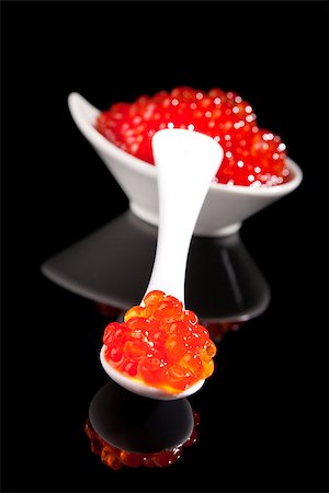 simsearch:6102-03828260,k - Luxurious red caviar on white spoon on black background with reflection. Culinary luxury foods. Stock Photo - Budget Royalty-Free & Subscription, Code: 400-08070595