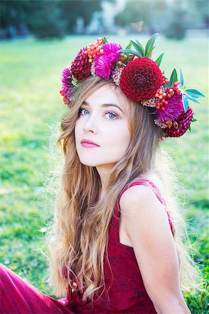 Woman in red with red flower wreath on a green meadow Stock Photo - Budget Royalty-Free & Subscription, Code: 400-08071009