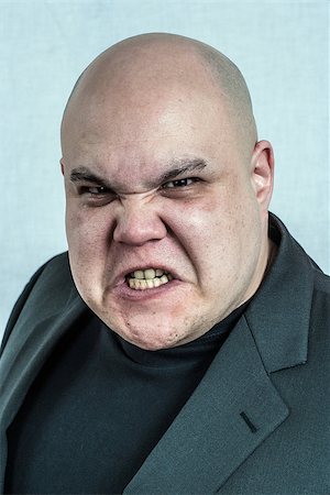 sad fat man - Photo of an angry bald man grimacing at the camera. Filtered to be more creepy. Stock Photo - Budget Royalty-Free & Subscription, Code: 400-08071093