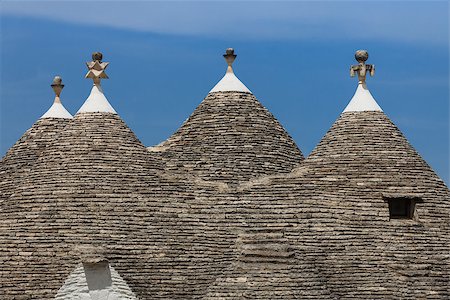 simsearch:862-06677053,k - Roofs of the Trulli houses. Typical historical houses of Alberobello's town. Holiday destination in Apulia. Italy Stock Photo - Budget Royalty-Free & Subscription, Code: 400-08071232