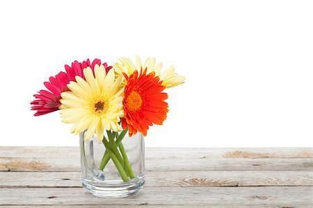 Colorful gerbera flowers on wooden table with copy space Stock Photo - Budget Royalty-Free & Subscription, Code: 400-08071431