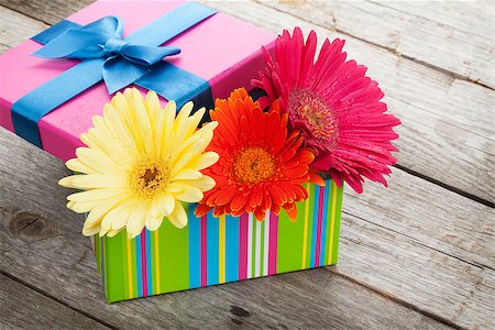 simsearch:400-07662543,k - Colorful gerbera flowers in gift box on wooden table with copy space Stock Photo - Budget Royalty-Free & Subscription, Code: 400-08071433