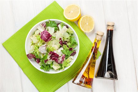 simsearch:400-06485512,k - Fresh healthy salad and condiments over white wooden table. View from above Stock Photo - Budget Royalty-Free & Subscription, Code: 400-08071507