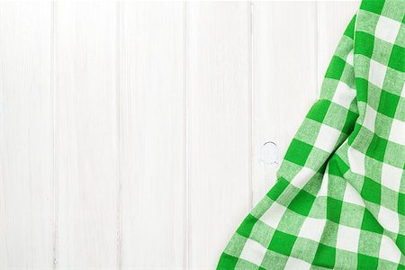 Green towel over wooden kitchen table. View from above with copy space Stock Photo - Budget Royalty-Free & Subscription, Code: 400-08071510