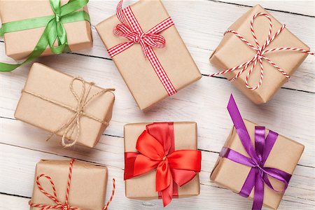Gift boxes on wooden table background Stock Photo - Budget Royalty-Free & Subscription, Code: 400-08071525