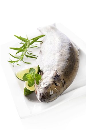 Delicious trout with herbs prepared for cooking. Culinary seafood cooking. Stock Photo - Budget Royalty-Free & Subscription, Code: 400-08072048