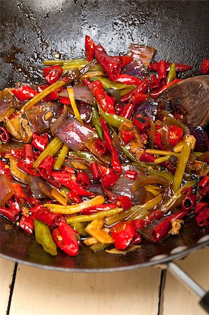 fried chili pepper and vegetable on a iron wok pan Stock Photo - Budget Royalty-Free & Subscription, Code: 400-08072100