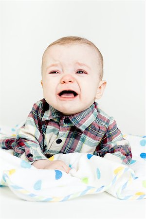 simsearch:400-07506232,k - Adorable baby screaming in a plaid shirt. studio photo Stock Photo - Budget Royalty-Free & Subscription, Code: 400-08072153