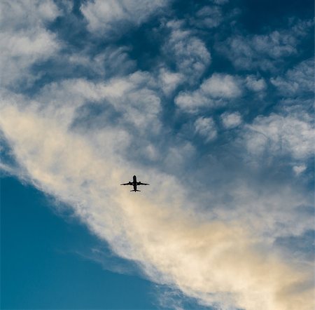 simsearch:6115-08066398,k - Airplane in the sky at sunset Stock Photo - Budget Royalty-Free & Subscription, Code: 400-08072319