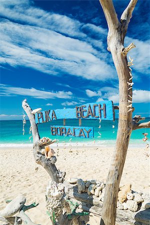 puka beach wooden sign in boracay island philippines Stock Photo - Budget Royalty-Free & Subscription, Code: 400-08072387