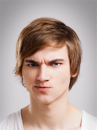 simsearch:400-05284316,k - Portrait of a handsome young man, over a gray background Stockbilder - Microstock & Abonnement, Bildnummer: 400-08072490