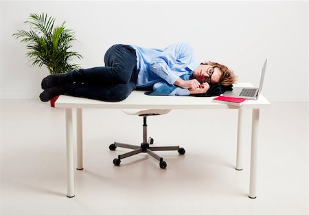 simsearch:400-08551867,k - Young man in the office and sleeping over is desk Stock Photo - Budget Royalty-Free & Subscription, Code: 400-08072524