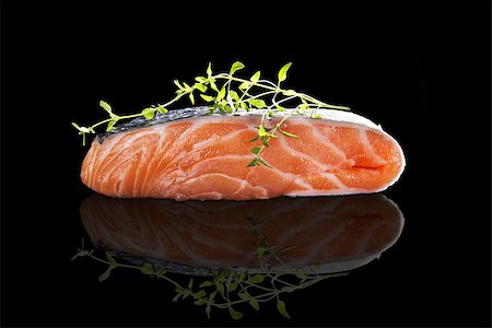 simsearch:400-08070549,k - Salmon steak isolated on black background. Culinary seafood eating. Stockbilder - Microstock & Abonnement, Bildnummer: 400-08073380