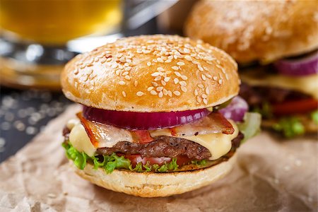 Delicious burger with beef, bacon, cheese and vegetables Stock Photo - Budget Royalty-Free & Subscription, Code: 400-08073648
