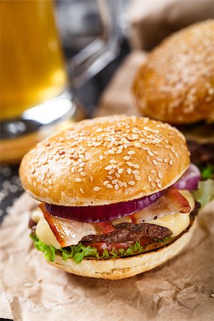 Delicious burger with beef, bacon, cheese and vegetables Stock Photo - Budget Royalty-Free & Subscription, Code: 400-08073649