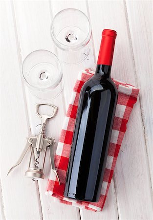 simsearch:400-07937813,k - Red wine bottle, glasses and corkscrew on white wooden table background Photographie de stock - Aubaine LD & Abonnement, Code: 400-08073849