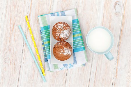 Cup of milk and cakes on white wooden table. Top view Stock Photo - Budget Royalty-Free & Subscription, Code: 400-08073876