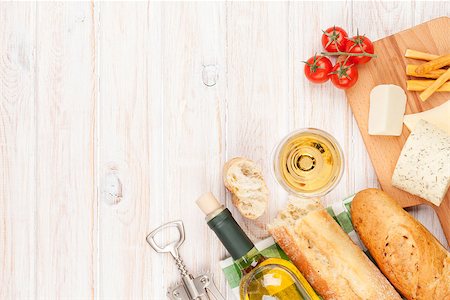 White wine, cheese and bread on white wooden table background. Top view with copy space Stock Photo - Budget Royalty-Free & Subscription, Code: 400-08073888