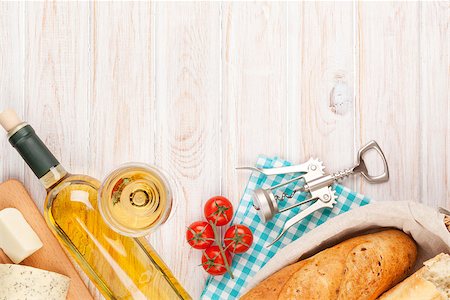 simsearch:400-08074810,k - White wine, cheese and bread on white wooden table background. Top view with copy space Photographie de stock - Aubaine LD & Abonnement, Code: 400-08073890
