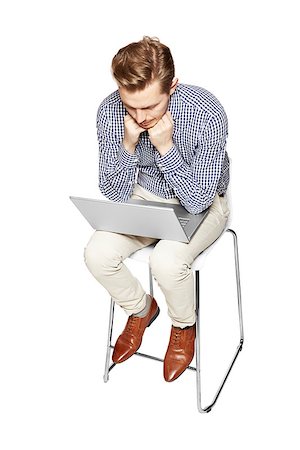 simsearch:400-04455693,k - Young man thinking over the computer. He is sad. Photographie de stock - Aubaine LD & Abonnement, Code: 400-08094185