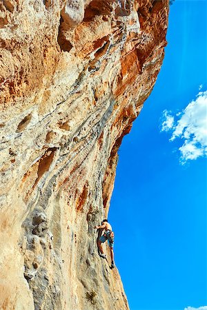 simsearch:400-08072896,k - male rock climber climbs on a rocky wall Foto de stock - Royalty-Free Super Valor e Assinatura, Número: 400-08094379