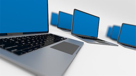 Many laptops in a circle isolated on white. Shallow depth of field. Foto de stock - Royalty-Free Super Valor e Assinatura, Número: 400-08094389