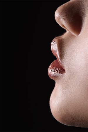 side lips view pictures - Macro side view of sensual shiny lips and chin. High resolution studio shot Stock Photo - Budget Royalty-Free & Subscription, Code: 400-08096298
