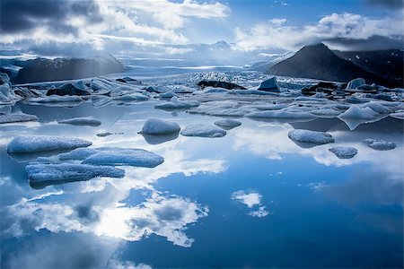 simsearch:400-08096760,k - Iceberg in Jokulsarlon glacier lake in Iceland. The icebergs, originating from the Vatnajokull float. This location was used for various action movies. Stock Photo - Budget Royalty-Free & Subscription, Code: 400-08096760