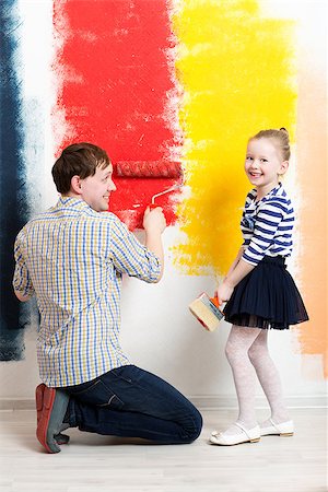 simsearch:400-05677233,k - Happy father and daughter enjoying colorful wall painting. Bright colors cheering up Stock Photo - Budget Royalty-Free & Subscription, Code: 400-08096898