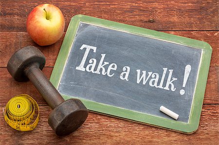 take a walk - fitness concept -  slate blackboard sign against weathered red painted barn wood with a dumbbell, apple and tape measure Stock Photo - Budget Royalty-Free & Subscription, Code: 400-08097325