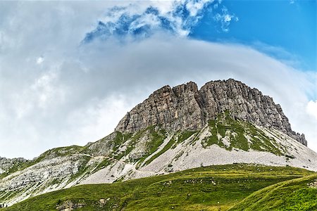rolle pass - Landscape of the Mountain Castellazzo seen from Rolle Passwith clouds and blue sky background, Dolomites, Trentino - Italy Stock Photo - Budget Royalty-Free & Subscription, Code: 400-08097786