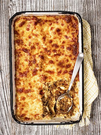 simsearch:400-07955620,k - close up of a tray of rustic italian baked lasagna Photographie de stock - Aubaine LD & Abonnement, Code: 400-08097966