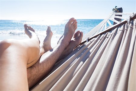 Happy couple napping together in the hammock at the beach Stock Photo - Budget Royalty-Free & Subscription, Code: 400-08099366
