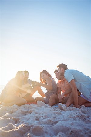 Happy hipsters relaxing and playing guitar at the beach Stock Photo - Budget Royalty-Free & Subscription, Code: 400-08099478