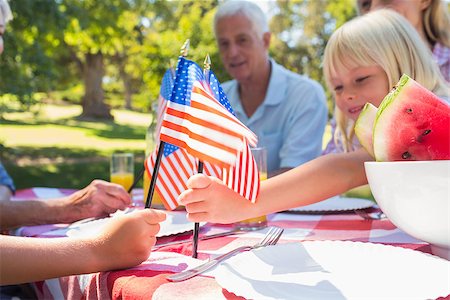 rural american and family - Happy family having picnic and holding american flag on a sunny day Stock Photo - Budget Royalty-Free & Subscription, Code: 400-08099647