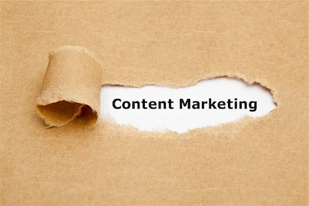 The text Content Marketing appearing behind torn brown paper. Stock Photo - Budget Royalty-Free & Subscription, Code: 400-08093978