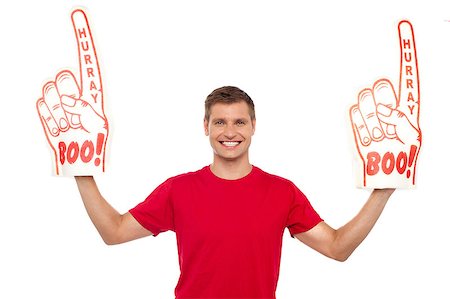 fan and foam finger - Young energetic fan showing his support by holding two large foam hands Stock Photo - Budget Royalty-Free & Subscription, Code: 400-08107337