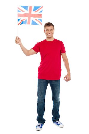 Causal guy waving United Kingdom flag isolated over white background Photographie de stock - Aubaine LD & Abonnement, Code: 400-08107340