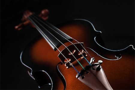 Beautiful red violin located on a black background Stock Photo - Budget Royalty-Free & Subscription, Code: 400-08107525